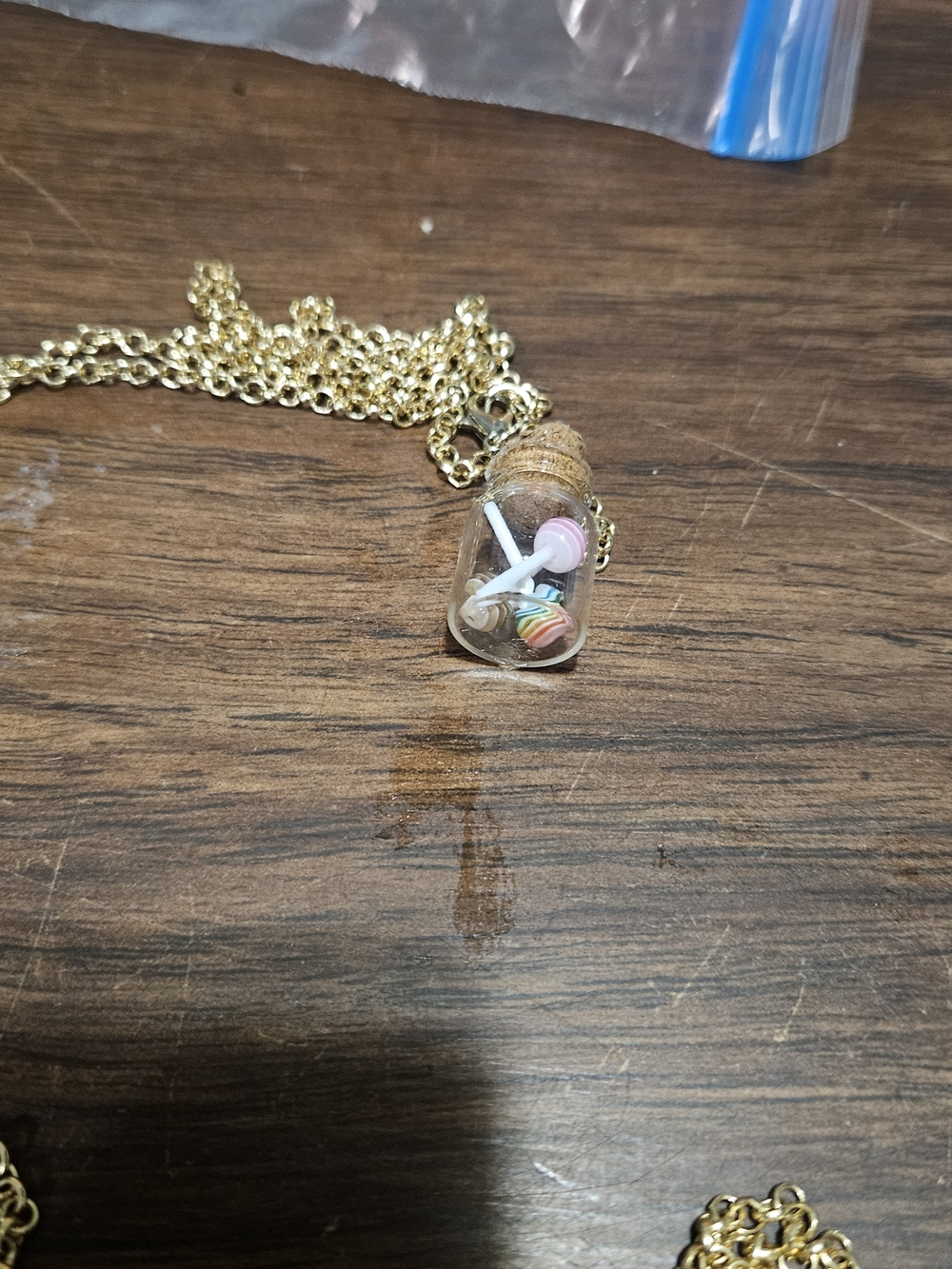 Gold-Tone Mini Ginnie Bottle Pendant Necklace with Pink Accent